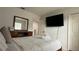 This bedroom offers a television, dresser, and natural light at 513 Bailey Cir, Davenport, FL 33897