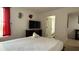 This bedroom features a television and an attached bathroom for extra convenience at 513 Bailey Cir, Davenport, FL 33897
