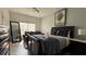 Inviting bedroom features a cozy bed, a large mirror, and soft natural lighting at 513 Bailey Cir, Davenport, FL 33897