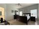 Bedroom with hard wood floors, white walls, a ceiling fan, and windows with blinds at 513 Bailey Cir, Davenport, FL 33897