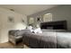 Bedroom featuring two beds, light wood floors, modern wall decor, and white walls at 513 Bailey Cir, Davenport, FL 33897