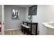 Dining area featuring a high-top table with three stools and decorative artwork at 513 Bailey Cir, Davenport, FL 33897