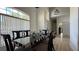 Elegant dining room features a modern table, large windows, and ample natural light at 513 Bailey Cir, Davenport, FL 33897