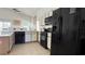 Well-equipped kitchen with modern appliances, ample counter space, and bar seating at 513 Bailey Cir, Davenport, FL 33897