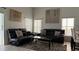 Comfortable living room with modern sofas, stylish decor, and plenty of seating space at 513 Bailey Cir, Davenport, FL 33897