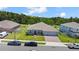 Aerial view of a beautiful home with a well-kept lawn at 5264 Obsidian Gate Dr, Mount Dora, FL 32757