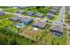 Aerial view of the property showing a swimming pool and the surrounding community at 5264 Obsidian Gate Dr, Mount Dora, FL 32757
