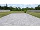 Well-manicured backyard featuring a spacious patio and lush landscaping at 5264 Obsidian Gate Dr, Mount Dora, FL 32757