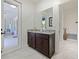 Modern bathroom with granite countertop vanity and ample natural light at 5264 Obsidian Gate Dr, Mount Dora, FL 32757