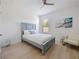 Inviting bedroom with natural light, ceiling fan, and beach-themed decor at 5264 Obsidian Gate Dr, Mount Dora, FL 32757