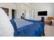 This bedroom features an attached bathroom and walk-in closet for maximized convenience at 5264 Obsidian Gate Dr, Mount Dora, FL 32757