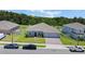Charming one-story home with a brick driveway, well-maintained lawn, and lush landscaping at 5264 Obsidian Gate Dr, Mount Dora, FL 32757