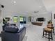Expansive living room with modern furniture, ample seating, high ceilings and lots of natural light at 5264 Obsidian Gate Dr, Mount Dora, FL 32757