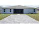Spacious patio area with a screened lanai, perfect for outdoor entertaining at 5264 Obsidian Gate Dr, Mount Dora, FL 32757