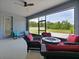 This screened-in patio features a firepit, plenty of seating, and a gorgeous view of the backyard at 5264 Obsidian Gate Dr, Mount Dora, FL 32757