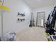 Spacious walk-in closet includes shelving, storage, and full-length mirror at 5264 Obsidian Gate Dr, Mount Dora, FL 32757
