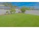 Spacious backyard with lush green grass and a privacy fence, ideal for outdoor activities and relaxation at 5353 Red Leaf Ct, Oviedo, FL 32765
