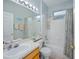 Bright bathroom with a tub and shower combination, large mirror, and ample counter space at 5353 Red Leaf Ct, Oviedo, FL 32765