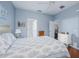 Bedroom with ceiling fan, hardwood floors, and views to the bathroom and living area at 5353 Red Leaf Ct, Oviedo, FL 32765
