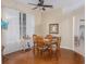 Formal dining room with hardwood floors, decorative mirror and plenty of natural light at 5353 Red Leaf Ct, Oviedo, FL 32765
