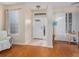 Bright foyer with tile flooring, a decorative front door, and natural light from surrounding windows at 5353 Red Leaf Ct, Oviedo, FL 32765