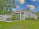 Inviting home with manicured lawn, decorative shrubbery, and a welcoming entrance, creating a warm first impression at 5353 Red Leaf Ct, Oviedo, FL 32765