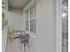 Cozy front porch with a small seating area, perfect for enjoying quiet moments outdoors at 5353 Red Leaf Ct, Oviedo, FL 32765