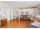 Spacious living room featuring hardwood floors, comfortable seating, and an open layout at 5353 Red Leaf Ct, Oviedo, FL 32765