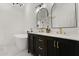 Elegant bathroom featuring double sink vanity, soaking tub, and modern fixtures at 5451 Los Palma Vista Dr, Orlando, FL 32837