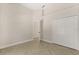 Bedroom with a closet and doorway, featuring herringbone-patterned tile flooring at 5451 Los Palma Vista Dr, Orlando, FL 32837