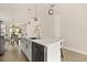 Bright kitchen island featuring gold faucet and hardware, and stainless steel dishwasher at 5451 Los Palma Vista Dr, Orlando, FL 32837