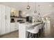 Modern kitchen with white cabinetry, a quartz countertop island, and stainless steel appliances at 5451 Los Palma Vista Dr, Orlando, FL 32837