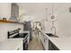 Modern kitchen featuring stainless steel appliances, elegant countertops, and stylish pendant lighting at 5451 Los Palma Vista Dr, Orlando, FL 32837
