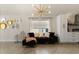 Stylish living room featuring herringbone floors, recessed lighting, and comfortable contemporary furniture at 5451 Los Palma Vista Dr, Orlando, FL 32837