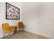 Cozy living room area with two mustard-colored velvet chairs and modern decor at 5451 Los Palma Vista Dr, Orlando, FL 32837
