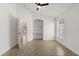 Bright room features tile flooring in herringbone pattern, arched alcove, and natural light at 5451 Los Palma Vista Dr, Orlando, FL 32837
