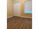 Bedroom with a large closet, gray flooring, and a bright window at 5821 La Costa Dr # 108, Orlando, FL 32807