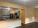 A kitchen featuring a breakfast bar, stainless appliances, and granite countertops at 5821 La Costa Dr # 108, Orlando, FL 32807