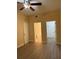 A main bedroom with wood floors, access to bathroom and walk-in closet at 5821 La Costa Dr # 108, Orlando, FL 32807