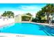 Community pool offering a turquoise refreshing swimming area near building at 5821 La Costa Dr # 108, Orlando, FL 32807