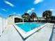 Exterior shot of the community pool showcasing a refreshing turquoise pool on a sunny day at 5821 La Costa Dr # 108, Orlando, FL 32807