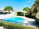 Clear turquoise community pool showcasing landscaping and a cabana at 5821 La Costa Dr # 108, Orlando, FL 32807