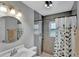 Modern bathroom with stylish fixtures, neutral gray walls, shower and tub combo at 601 Swallow Ct, Apopka, FL 32712