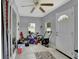Organized garage space with tiled floors, suitable for storage and home projects at 601 Swallow Ct, Apopka, FL 32712