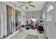 Tidy garage area featuring tile flooring, ideal for storage and various activities at 601 Swallow Ct, Apopka, FL 32712