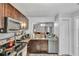 Modern kitchen showcasing stainless steel appliances, granite countertops, and stylish cabinetry at 601 Swallow Ct, Apopka, FL 32712