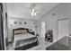 Relaxing main bedroom featuring lots of light, soothing gray walls, and a ceiling fan at 601 Swallow Ct, Apopka, FL 32712