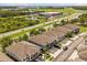 Aerial view of homes in a community near green space and a major highway at 6566 S Goldenrod Rd # 82A, Orlando, FL 32822