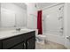 Well-lit bathroom featuring a shower-tub combo, vanity with sink, and tile flooring at 6566 S Goldenrod Rd # 82A, Orlando, FL 32822