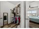 Walk-in closet with shelving and hanging space, opens into a bedroom with fan at 6566 S Goldenrod Rd # 82A, Orlando, FL 32822